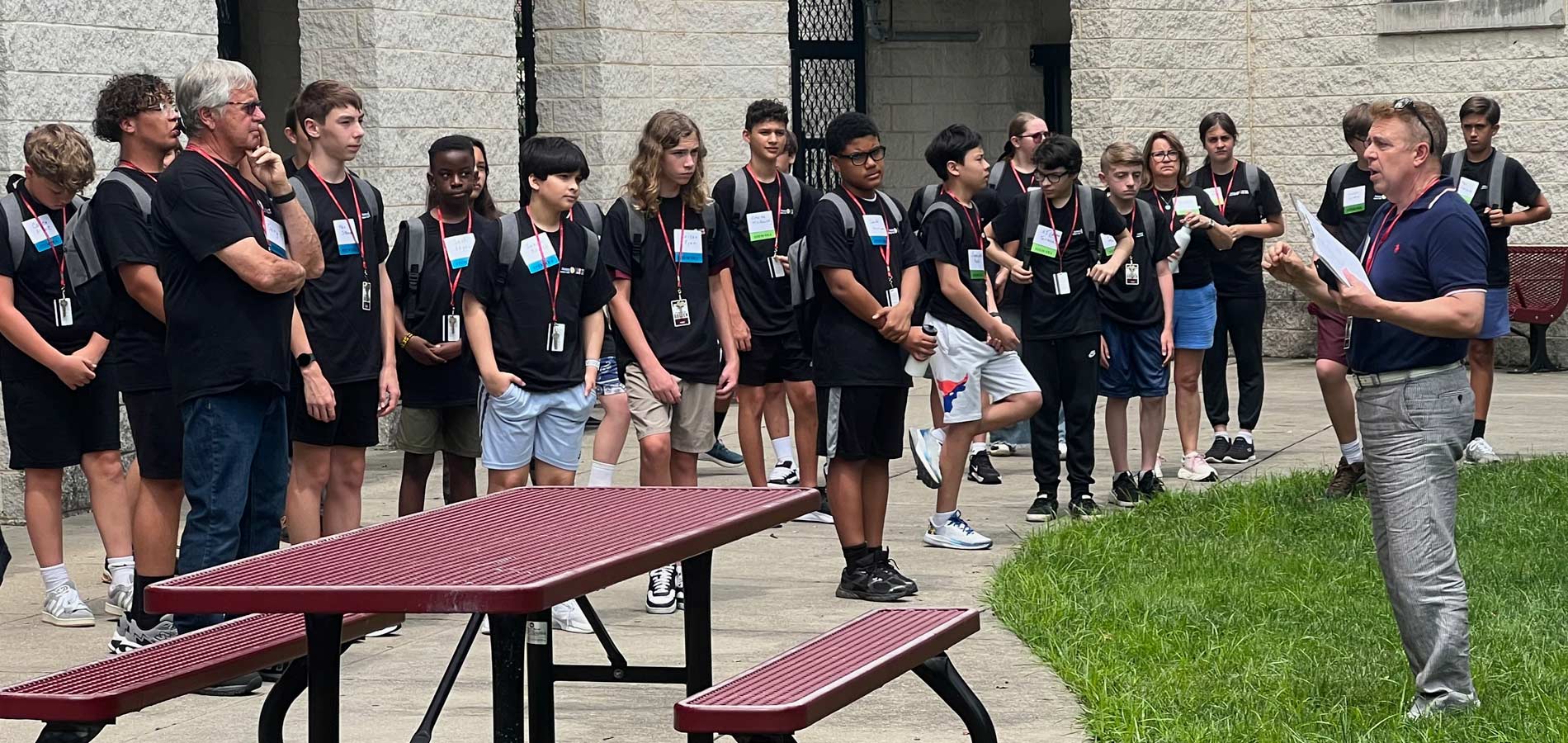 Students arrive for check-in and get an idea of the first day's events from Director Tony Moyer.